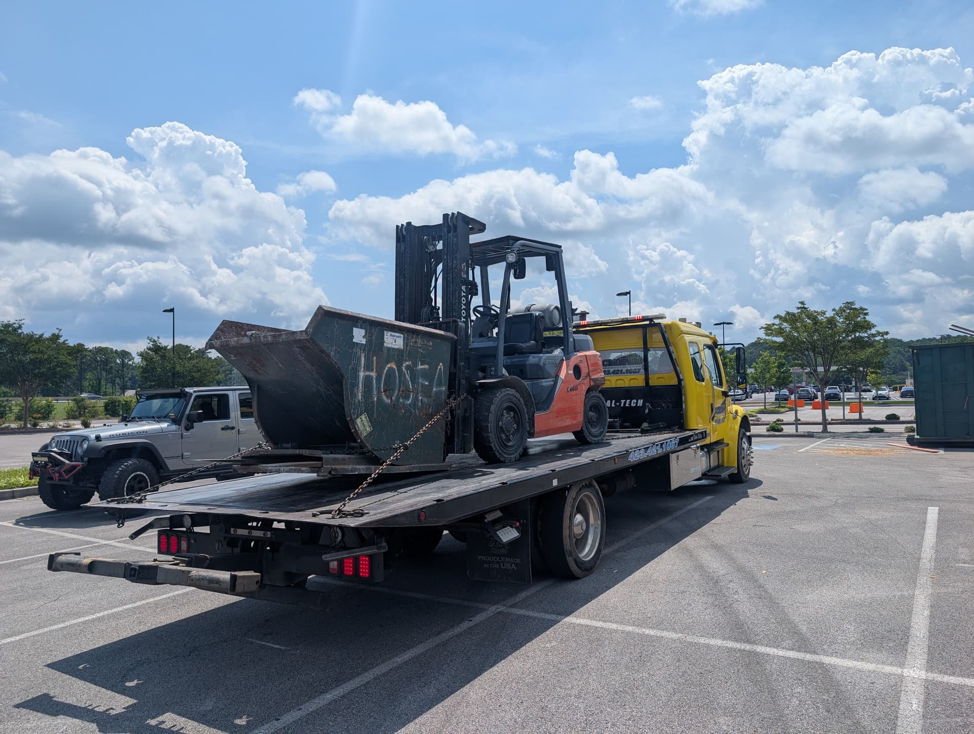 Gallery photos for Forklift and Dumpster Hauled to Keep a Job Site Moving: Image #2